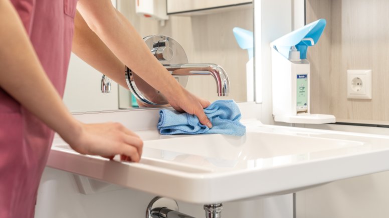 HEWI washbasin is cleaned with a cloth